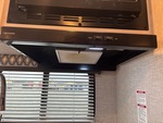 Interior with Stove Hood Exhaust Fan and Vent Cover