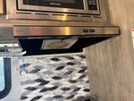 Interior with Stove Hood Exhaust Fan and Vent Cover