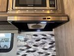 Interior with Stove Hood Exhaust Fan and Vent Cover