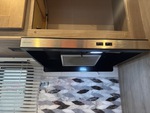 Interior with Stove Hood Exhaust Fan and Vent Cover