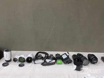 (7) Assorted Camera Lenses, (2) Digital Cameras, (1) Power Supply & (1) Flash