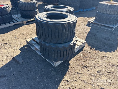 Quantity of (4) Caterpillar 33-15.5x16.5 Tires (Unused) - Fits Skid Steer/Man Lift