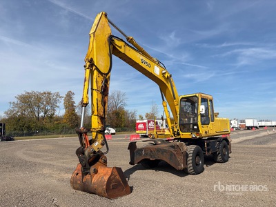 1990 John Deere 595D を見 Wheel Excavator