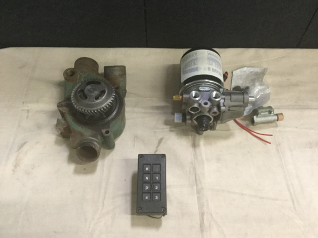 (1) Transmission Controller, (1) Water Pump & Assorted Parts (1) Transmission Controller, (1) Water Pump & Assorted Parts