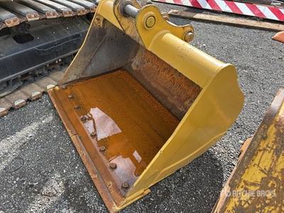 Cat 60 in Cleanup Excavator Bucket